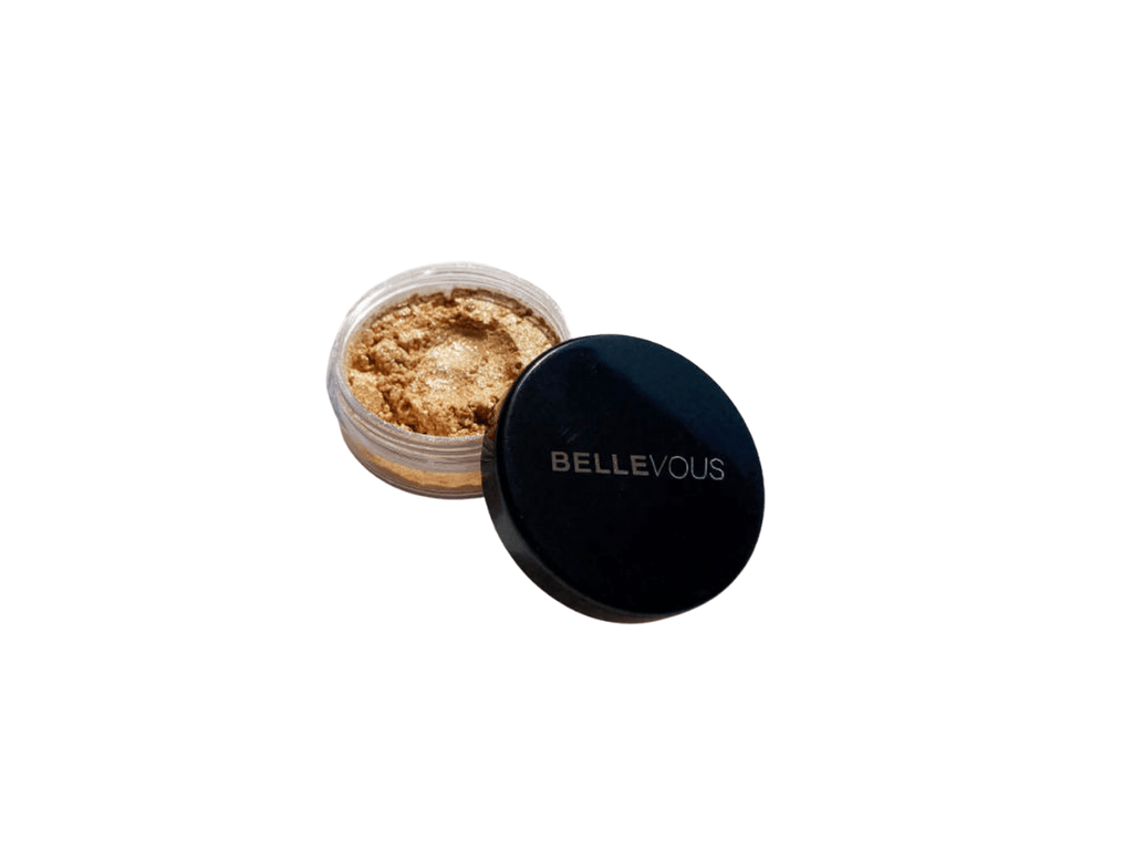 That Glow  A shimmering loose highlighter in powder form is highly reflective with iridescent pearls that provides an intense sparkle payoff. Easy to blend and a little goes a long  For Medium - Dark Skin Tones  Golden Shimmer