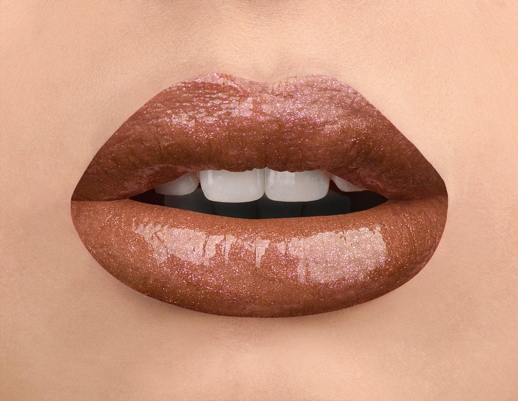 Dazzle and shine with our Nude Remix High Shine Lip Strobes! Add a touch of gold or rose to your lips for a natural, iridescent look. These glosses are packed with pearls and other rich pigments for beautiful color payoff. Wear them alone or over your favorite lipgloss for an extra boost of shimmer.